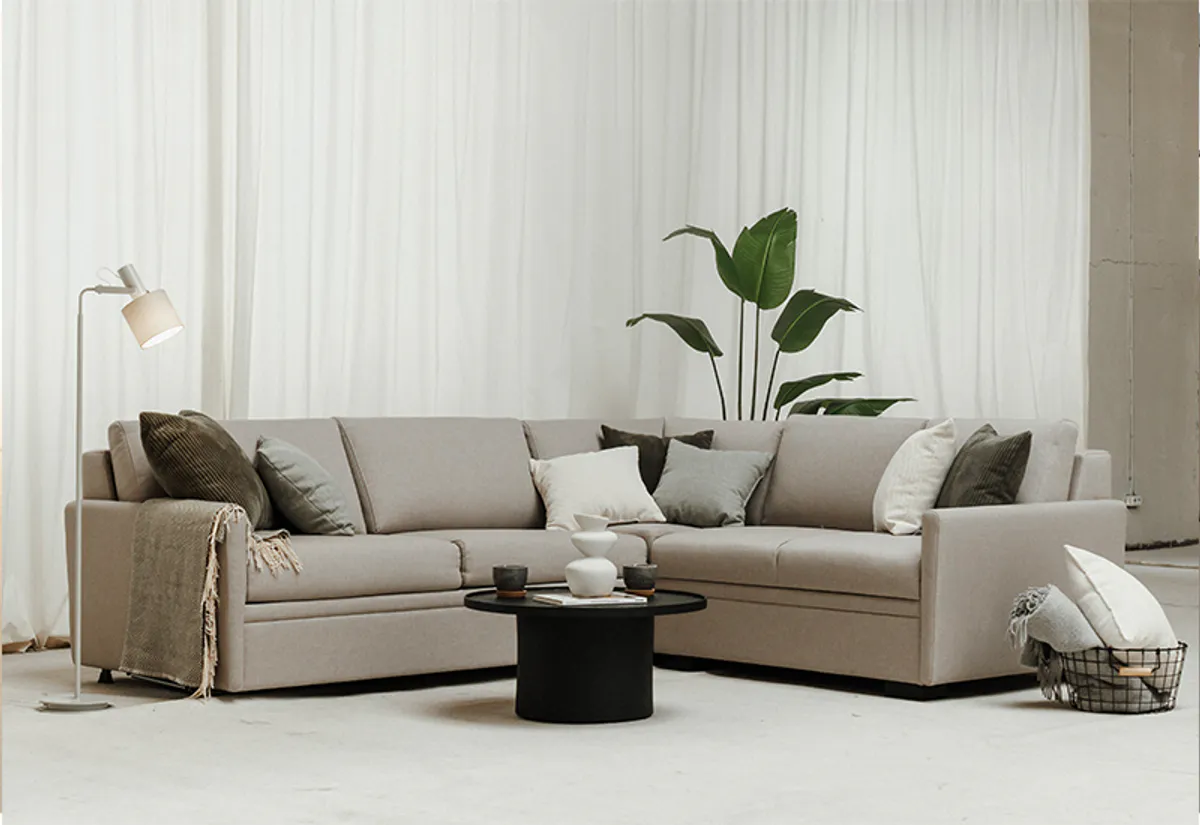 Harmony Hjørnesovesofa i grått tekstil bed innside